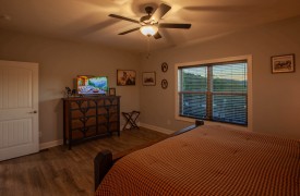 Skyfall | Cabin Rentals of Georgia | Main Level Master King Suite with windows and TV