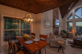 Skyfall | Cabin Rentals of Georgia | Dining Table Overlooking Living Room