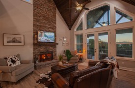 Skyfall | Cabin Rentals of Georgia | Luxury living area with window wall, mountain view, and upscale furnishings