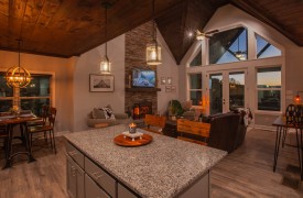 Skyfall | Cabin Rentals of Georgia | Open-concept main floor with kitchen, dining, and living room connected