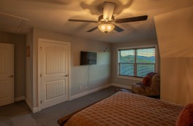 Skyfall | Cabin Rentals of Georgia | Upstairs Queen Suite with TV, closet, and mountain views