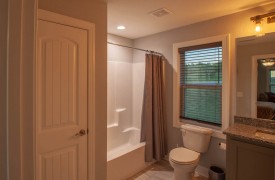 Skyfall | Cabin Rentals of Georgia | Upstairs Queen Bathroom with single vanity and tub shower combination