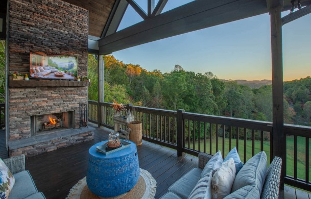 Skyfall | Cabin Rentals of Georgia | Luxury outdoor living area with fireplace and TV overlooking mountain view